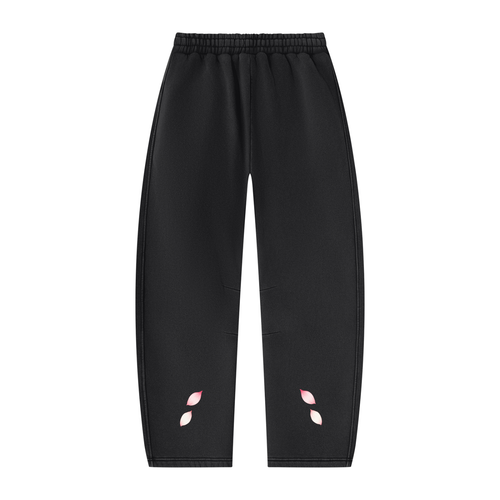 Back of the black INPUT Cherry Blossom Barrel sweatpants with pink petal accents