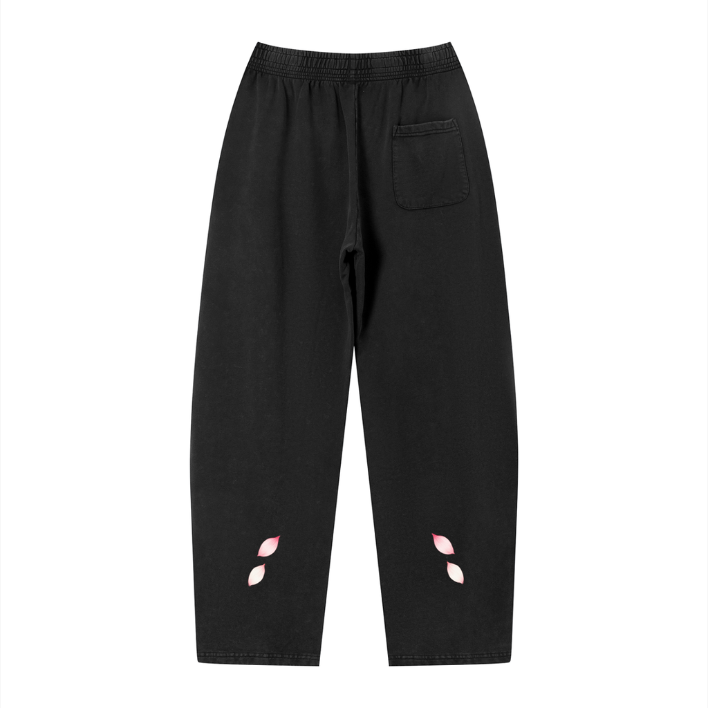 Back of the black INPUT Cherry Blossom Loose sweatpants, with rear pocket and small pink petals
